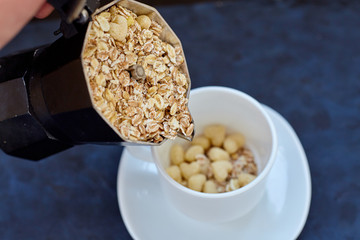 Oat-flakes, coffee on blue background. Cereals.