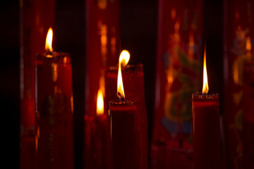 Candle light worship on black background