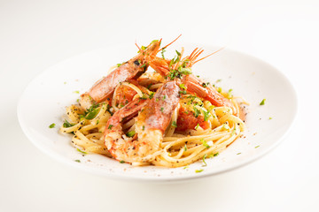 Linguine with garlic and king prawns on a plate