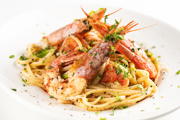 Linguine with garlic and king prawns on a plate