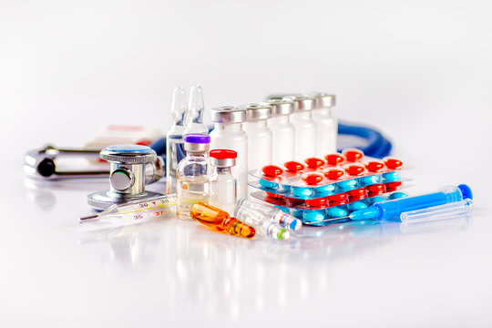 Drug prescription for treatment medication. Pharmaceutical medicament, cure in container for health. Pharmacy theme, capsule pills with medicine antibiotic in packages.