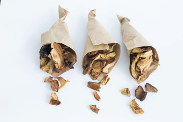 Dry mushroom chips in paper bags