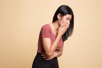 Young Asian woman got stomachache about to vomit.
