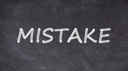 Fototapeta premium Mistake text written on blackboard