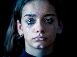 Portrait of sad, unhappy young girl crying. Helpless, depressed