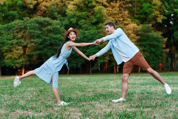 young couple running in the park