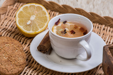 cup of tea with lemon and cookies