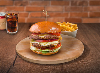 Beef burger on wooden background. For fast food restaurant design or fast food menu