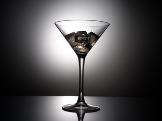 empty martini glass on black background
