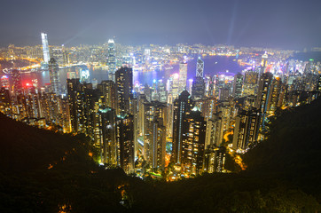 Night view of modern buildings along Victoria Harbour in Hong Kong
