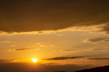 Red sunset with cloudy sky