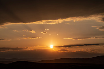 Red sunset with cloudy sky