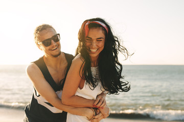 Affectionate couple enjoying on beach vacation