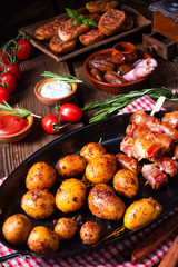 Rustic dates wrapped in bacon and young roasted potato.