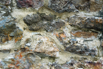 Texture of old antique wall with ancient colored masonry.