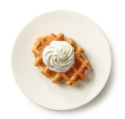 freshly baked belgian waffle on white plate