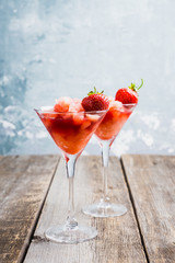 Frozen strawberry cocktail in martini glass. Selective focus.