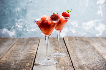 Frozen strawberry cocktail in martini glass. Selective focus.