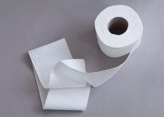 Toilet paper on gray background