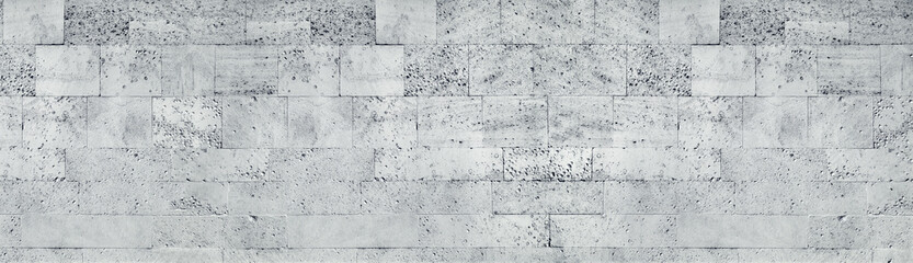 Tuff stone block wall wide texture. Gray rough masonry panorama. Long grunge background