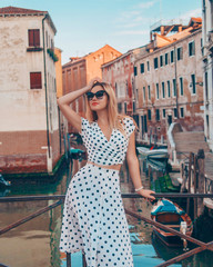 Fototapeta na wymiar Young woman walking in Venice