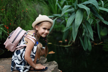 Kid in tropical garden