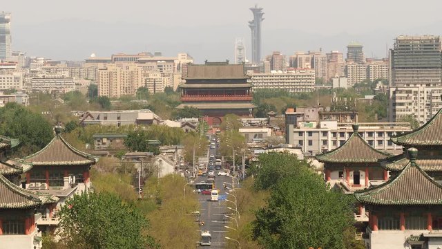 High angle view of Beijing, China, with busy road and old and new buildings.