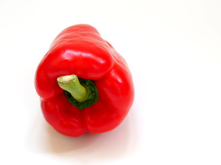 red sweet pepper on a contrasting white background.
