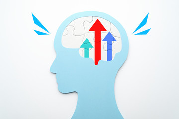 Motivation and improvement concept. Three growth arrows in brain. Head silhouette and brain shaped...