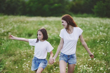 Fototapeta premium mother and daughter having fun in the park