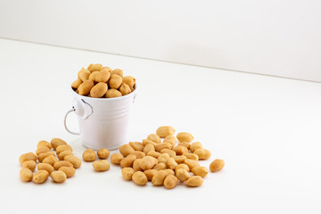 peanuts in a bowl isolated on white background