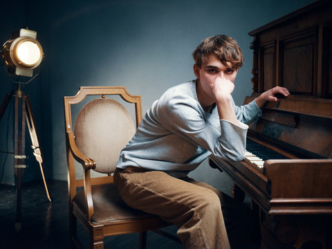 man sitting on chair and looking at camera