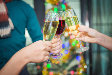 Cheers! Group of people toasting champagne for congratulating each other with new year. celebration and nightlife concept,
