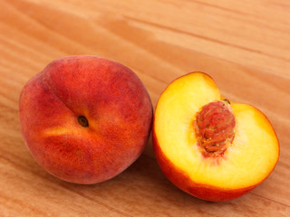 Naklejka na ściany i meble fresh peaches on wooden table