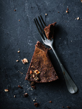 Chocolate cake piece closeup with fork