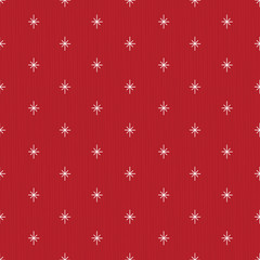 Pretty winter snowflakes seamless pattern with hand drawn elements on a textured background. Red and white design, perfect for Christmas gift wrapping paper, textiles, decorations and greeting cards.