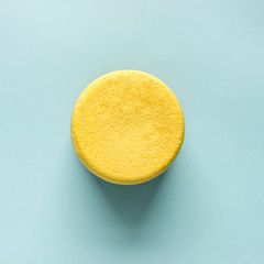 Top view yellow lemon cake on blue background. Sweet Lemon ring. Free sugar. Healthy food.