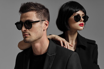 young man and woman in sunglasses