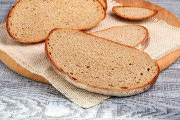 Fresh sliced bread on cutting board