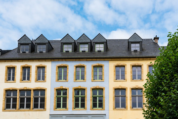 facade of yellow and blue building, with apartments. Thionville. France