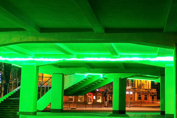 the architecture of the building stairs, with green lighting.