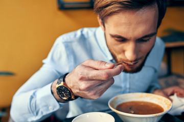 man drinking coffee in cafe