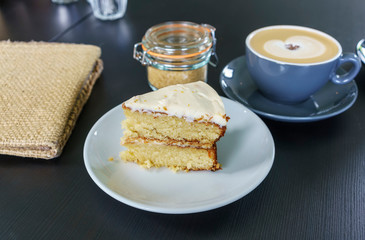 Delicious homemade super moist carrot cake slice served with latte or milk coffee in Scotland
