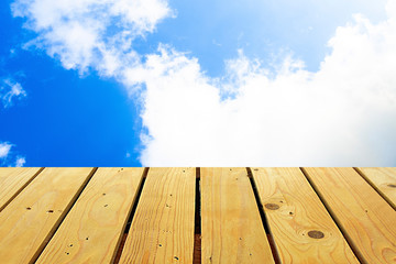 The blur cool blue sky white cloud with old Wooden table