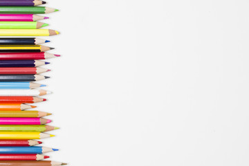 Border of an assortment of colourful pencils