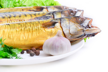 Smoked fish on plate close up mackerel