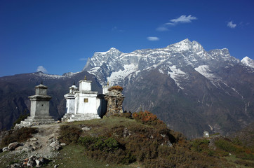 Fototapeta na wymiar Buddhist stupas in Himalaya mountains with view of Kongde mount, Sagarmatha national park, Khumbu valley, Nepal