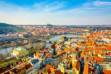 Obraz premium Aerial Panoramic View of Prague City above the River, Bridges and Old Town at Sunset Time
