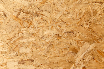 Pressed wooden panel background, seamless texture of oriented strand board - OSB