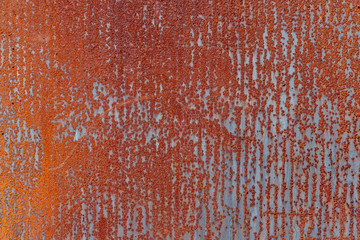 Bright rusty iron background with clear vertical signs of rain